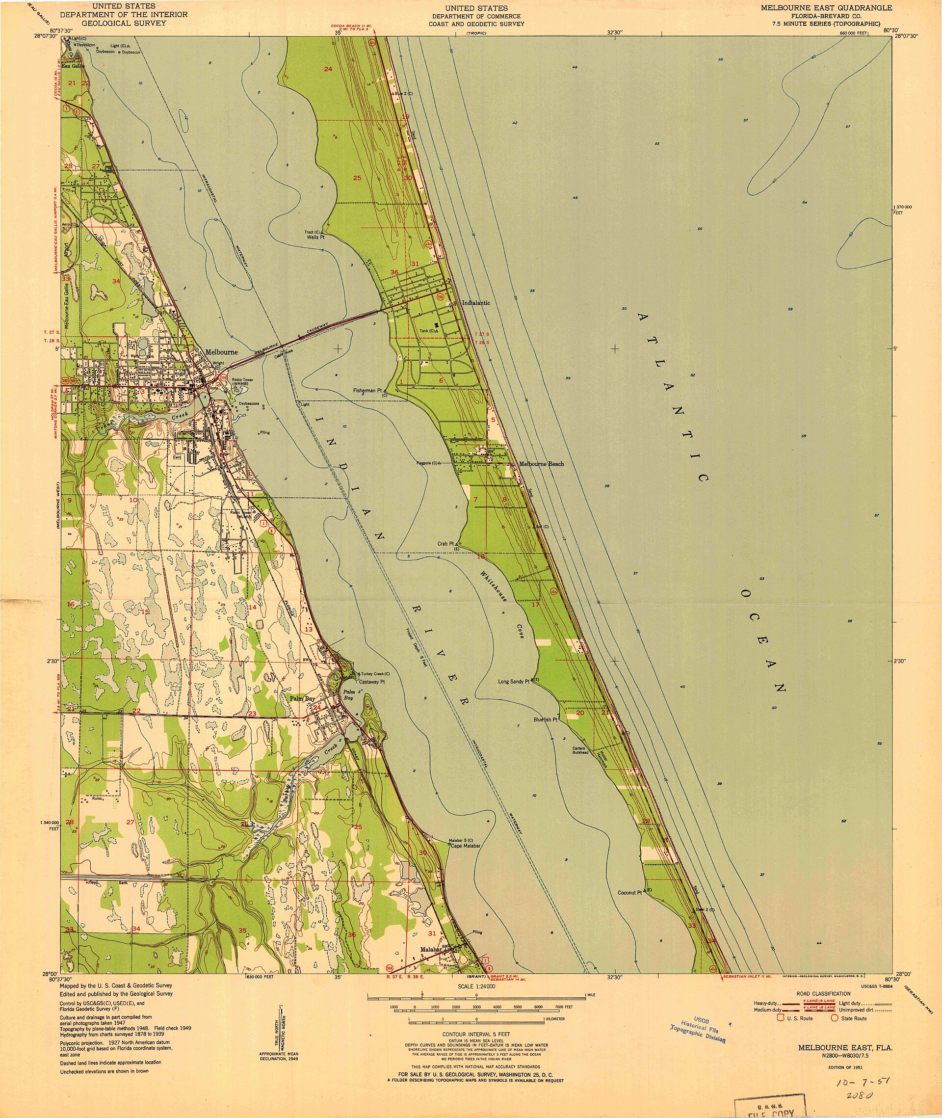 Aerial view of Melbourne, Florida in 1951, showing the Crane Creek waterfront, the FEC railroad tracks, and the early grid of downtown streets.